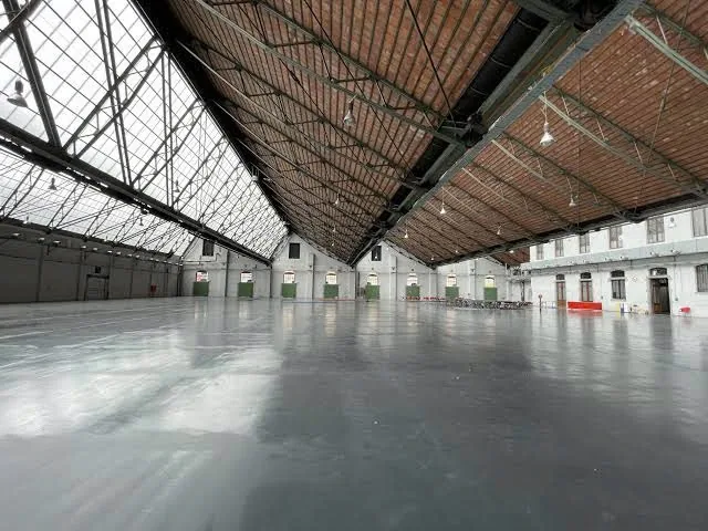 The main hall, empty, under its timber and glass roof.
